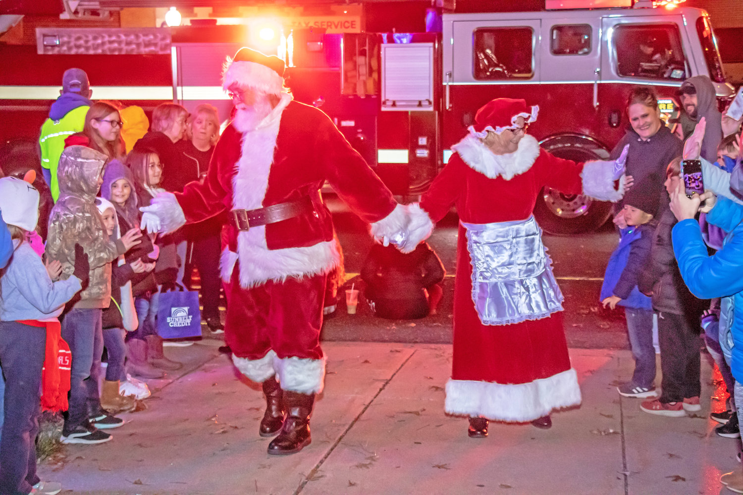 MR. AND MRS. CLAUS made their appearance in Clinton during last weekend's Christmas Parade. The night was cold, but the crowd was cheery!