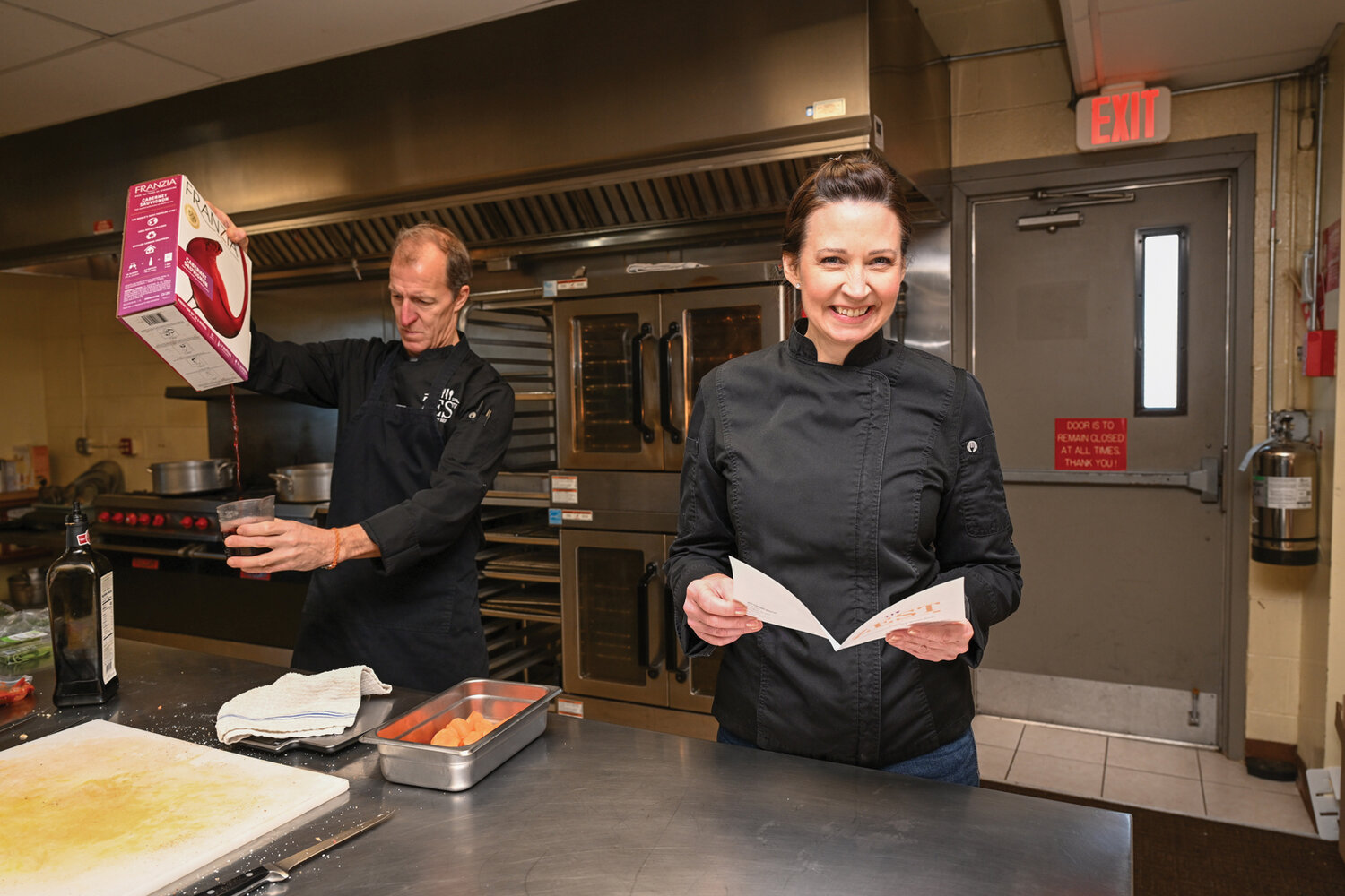 Theo Petron and Melissa Wieczorek, co-owners of Zest Culinary Services, in Buckingham, prepare meals for between fifteen to twenty customers each week with the help of two employees in a commercial kitchen in the Point Pleasant, Pennsylania, firehouse.