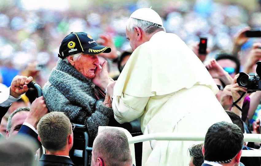 An elderly woman becomes emotional as Pope Francis greets her as he arrives for a May 2014 weekly audience in St. Peter&rsquo;s Square at the Vatican. Pope Francis wanted the first World Day for Grandparents and the Elderly on July 25 to be inaugurated as the world seeks to recover from a deadly pandemic, calling for the faithful to be &ldquo;angels,&rdquo; who care, console and caress.