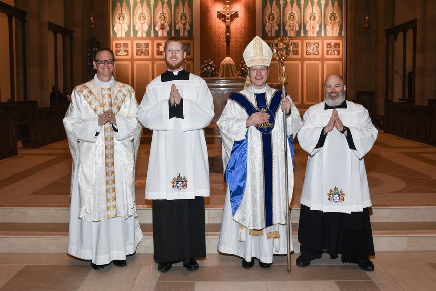 Very Reverend Steven P. Beseau, Rector/President of the Pontifical College Josephinum in Worthington, Ohio, joins seminarians Christopher Hoffmann and Phillip Novotny of the Jefferson City diocese and Bishop W. Shawn McKnight in the sanctuary of the college&rsquo;s the St. Turibius Chapel on Dec. 8.