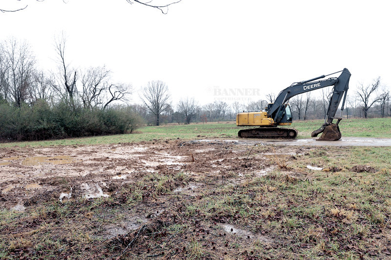 A trackhoe sits idle after razing a house along State Route 76 (US79) near Cutlip Lane in Trezevant. It was one of the many structures razed to clear a path for the new four-lane highway around Trezevant and Atwood.