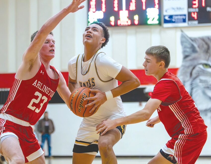 Colman-Egan&rsquo;s Julian Allen doesn&rsquo;t let the defense from Arlington stop him in earning 14 points during the Entringer Classic Dec. 31 in Brookings