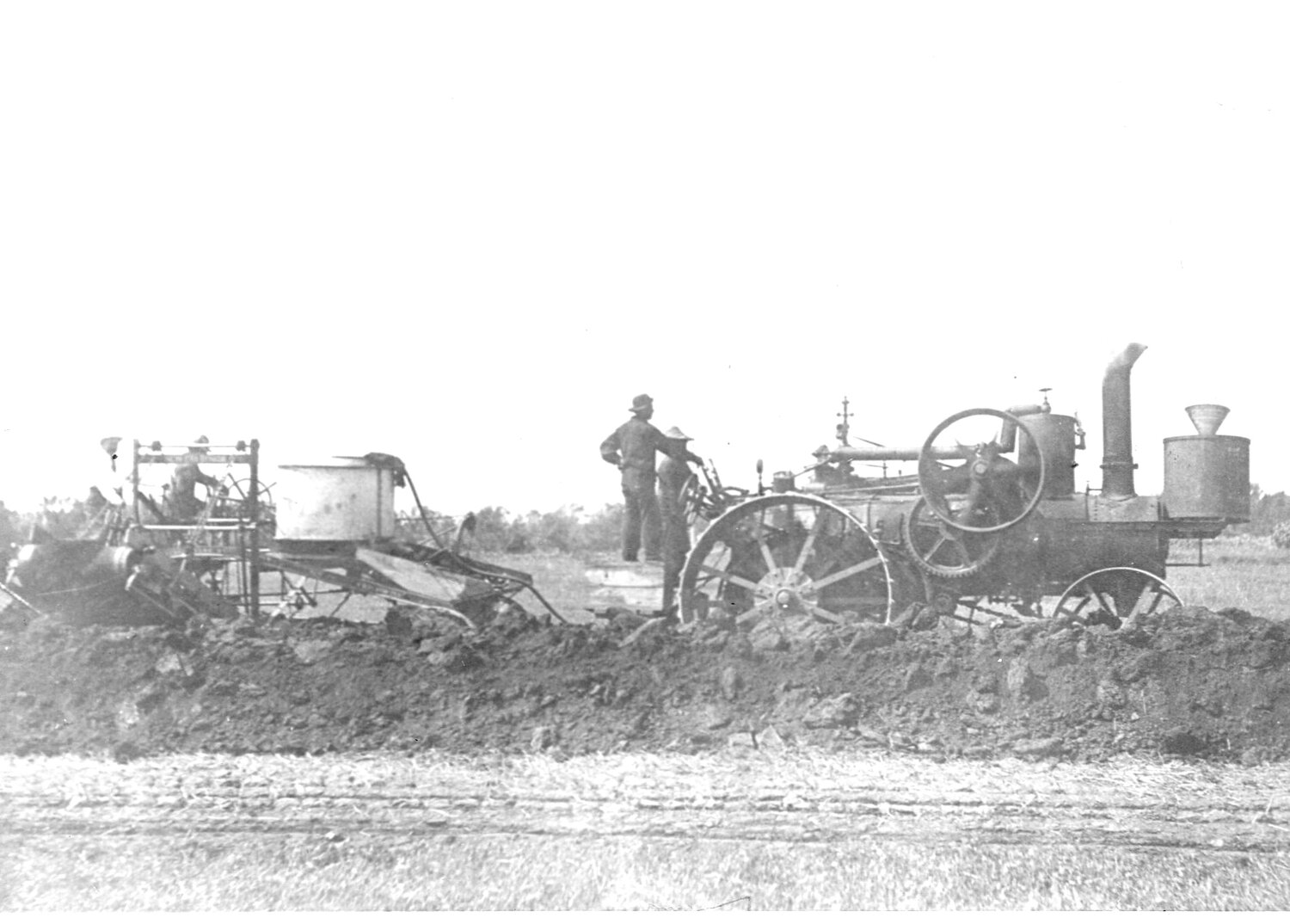 In October 1907 this steam traction machine was building the roadbed for the Brookings to Sioux Falls Electric Railroad tracks. But it all turned out to be a hoax. Today, all that remains of the electric railroad is a nice roadbed for the sidewalk extending from 14th Street to 20th Street along Medary Avenue.