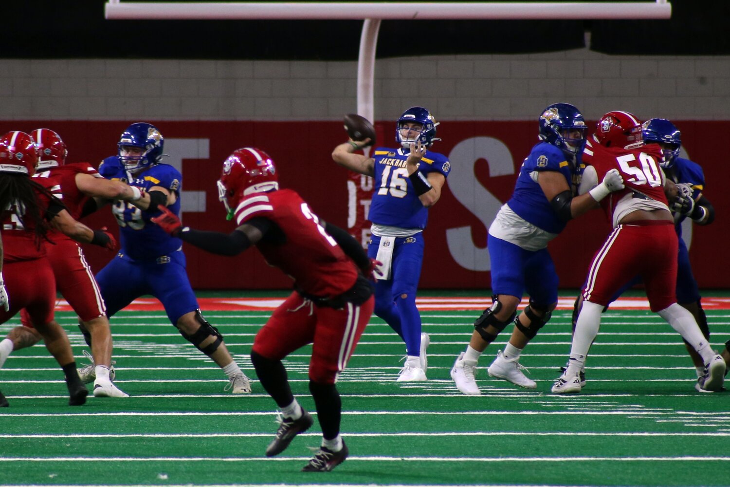 South Dakota State's Jack Henry prepares to pass the ball during a 24-17 loss to South Dakota on Saturday at the DakotaDome in Vermillion.