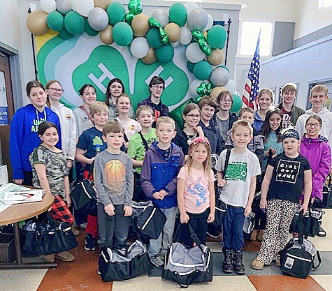 Little Leprechauns pack duffle bags for foster care program