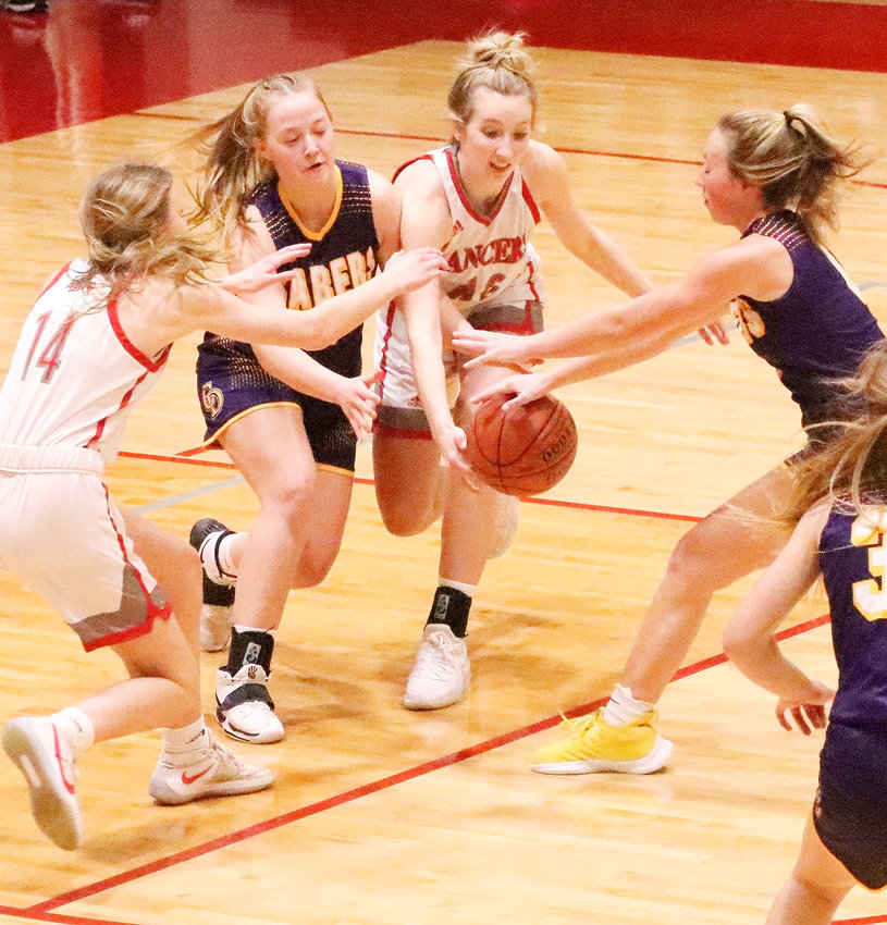 North Scott's battle with Central DeWitt on Tuesday (Jan. 3) was just what you would expect, and the intensity was on display in this loose ball battle between (l-r) Cora O'Neill, EmmaGrace Hartman, Lauren Golinghorst and Allie Meadows. Hartman was whistled for a foul on the play.