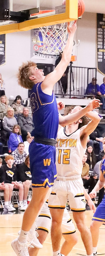 Wilton junior Caden Kirkman scored two of his 23 points with this nifty reverse lay-in against Tipton.