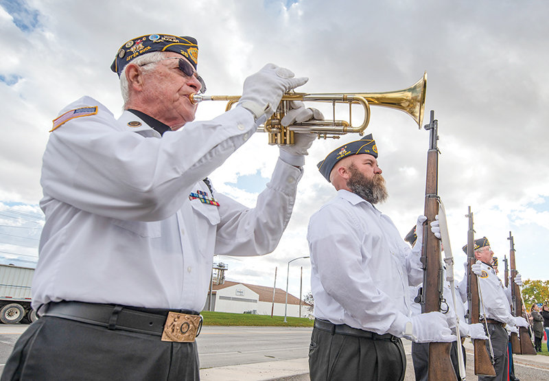 Bugler Tom Bibbey and other members of the American Legion Post 26 Honor Guard are pictured at the October 2020 unveilling of Powell&rsquo;s Wall of Honor. The honor guard is currently seeking additional members  to ensure that enough personnel are available to pay tribute to deceased veterans.