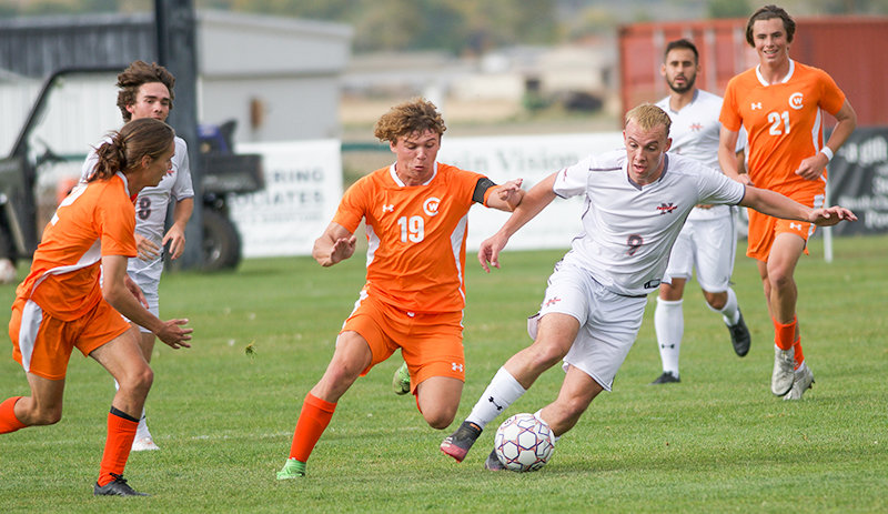 Thomas Mullen looks to break away from a Central Wyoming defender during a home matchup earlier this season. Mullen scored in the Trappers&rsquo; first round matchup against Casper, but NWC ultimately saw its season end in a 3-2 loss.