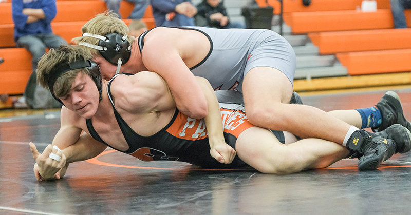 PHS sophomore Jimmy Dees tries to fight his way out of an early deficit against a Huntley Project wrestler during their dual on Jan. 11. Dees placed fourth at the Jug Beck Rocky Mountain Classic in Missoula last weekend.