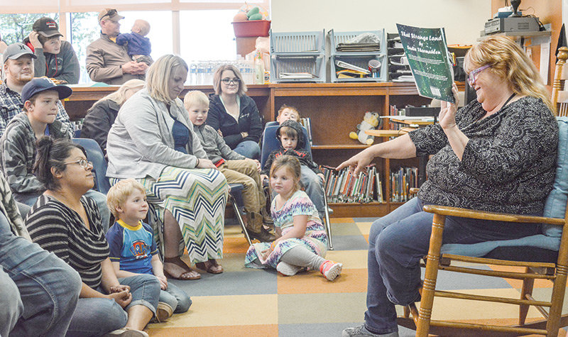 Sudie Thormahlen reads her book ‘That Strange Land’ at Southside Elementary School in May. Thormahlen retired from Southside at the end of the school year.