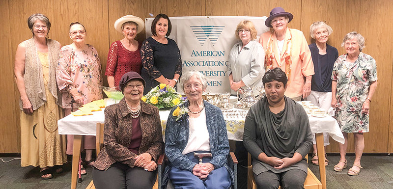 AAUW members gathered earlier this month to celebrate the Powell branch’s 70th anniversary. In the front row (from left), Charlotte Patrick, Shirley Cox and Deepthi Amarasuriya pose for a photo at the Powell Library. Pictured in the back row (from left) are Sharea Lindae Moan-Renaud, Linda Greaham, Marcia Wysocki, Necole Hanks, Maddi Van Epps, Claudia Fisher, Jo Cook and Elise Kimble.
