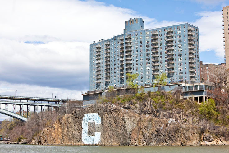 The 'Blue Building' at  2400 Johnson Ave. and Henry Hudson Bridge frame the diving rock.