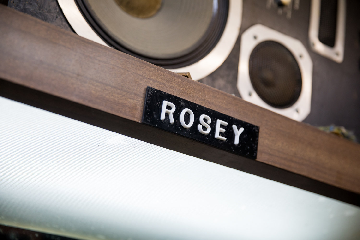 A name tag that reads ‘Rosey’ sits above the chair where Roosevelt ‘Rosey’ Spivey cuts hair in his shop. Marble Hill’s International Unisex Salon — which patrons know simply as Rosey’s Barber Shop — faces an uncertain future after a $1,500 rent hike.