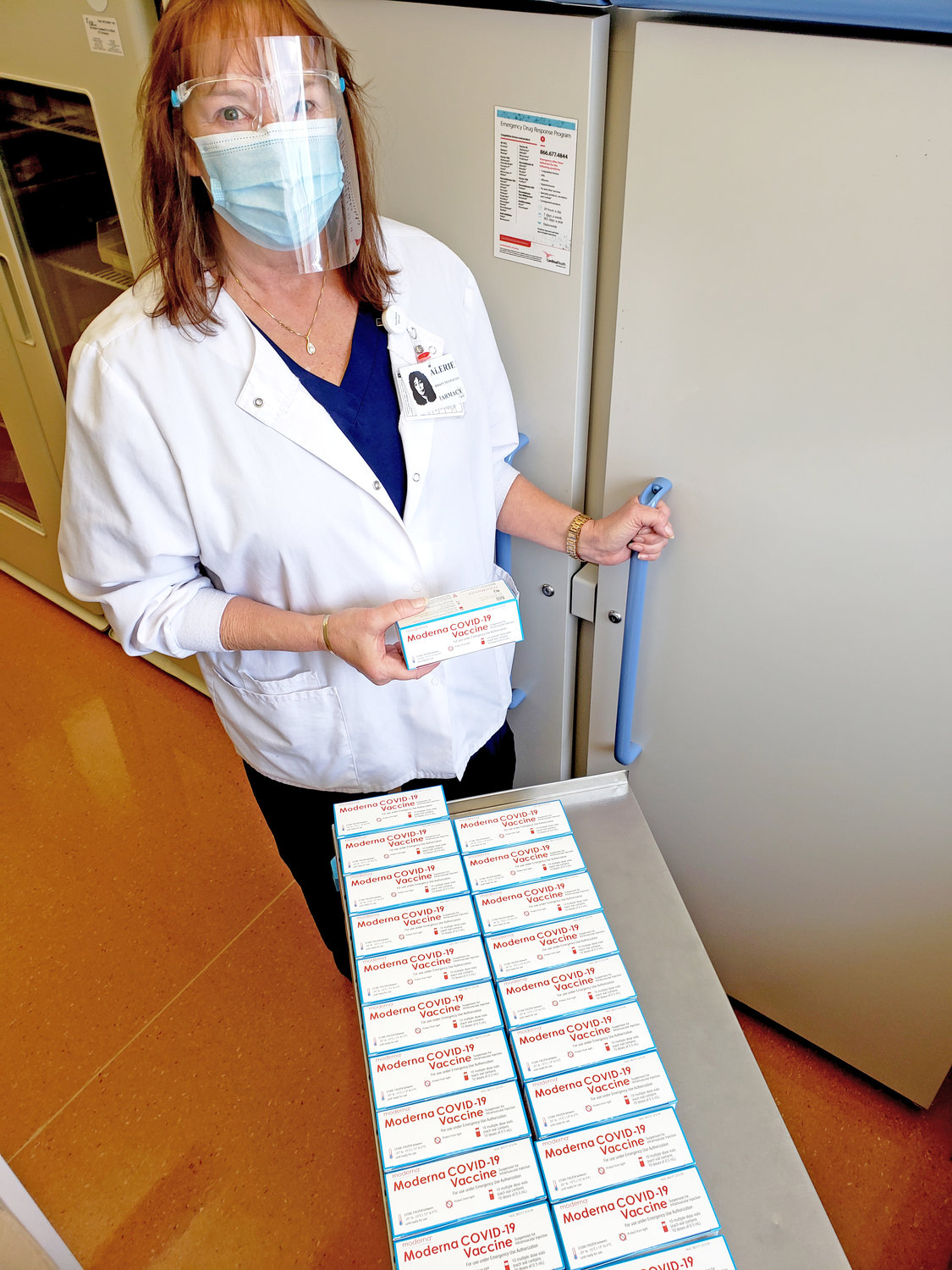 FIRST SHIPMENT RECEIVED — Pharmacy Technician Valerie Destito is pictured receiving Rome Memorial Hospital’s first shipment of Moderna vaccine Tuesday and will begin vaccinating employees at highest risk of exposure to COVID-19 beginning 7 a.m. Wednesday.