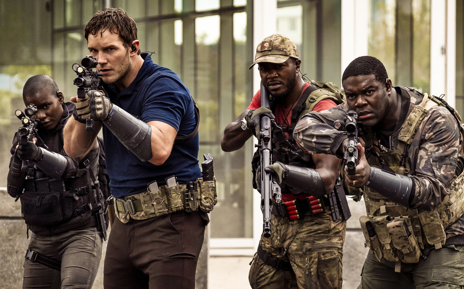 SERIOUS BUSINESS — Chris Pratt, from second left, Edwin Hodge and Sam Richardson in a scene from “The Tomorrow War.” “Pratt isn’t even allowed to be charming. Known for his wit and smile, Pratt plays his role completely straight, to the point of being pretty boring for a lead character.”