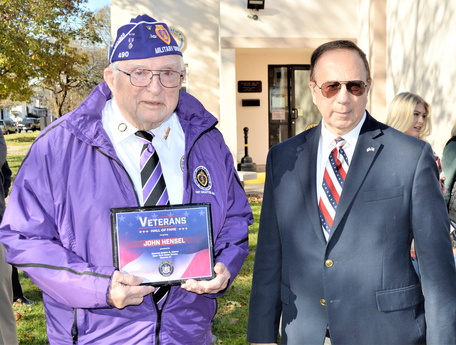 INDUCTED — John “Jack” Hensel, left, a Whitesboro resident and World War II veteran, receives a plaque from State Sen. Joseph A. Griffo, R-47, Rome, to commemorate Hensel’s  induction into the New York State Senate Veterans’ Hall of Fame. The Hall of Fame was created to honor and recognize outstanding veterans from New York State who have distinguished themselves both in military and civilian life.