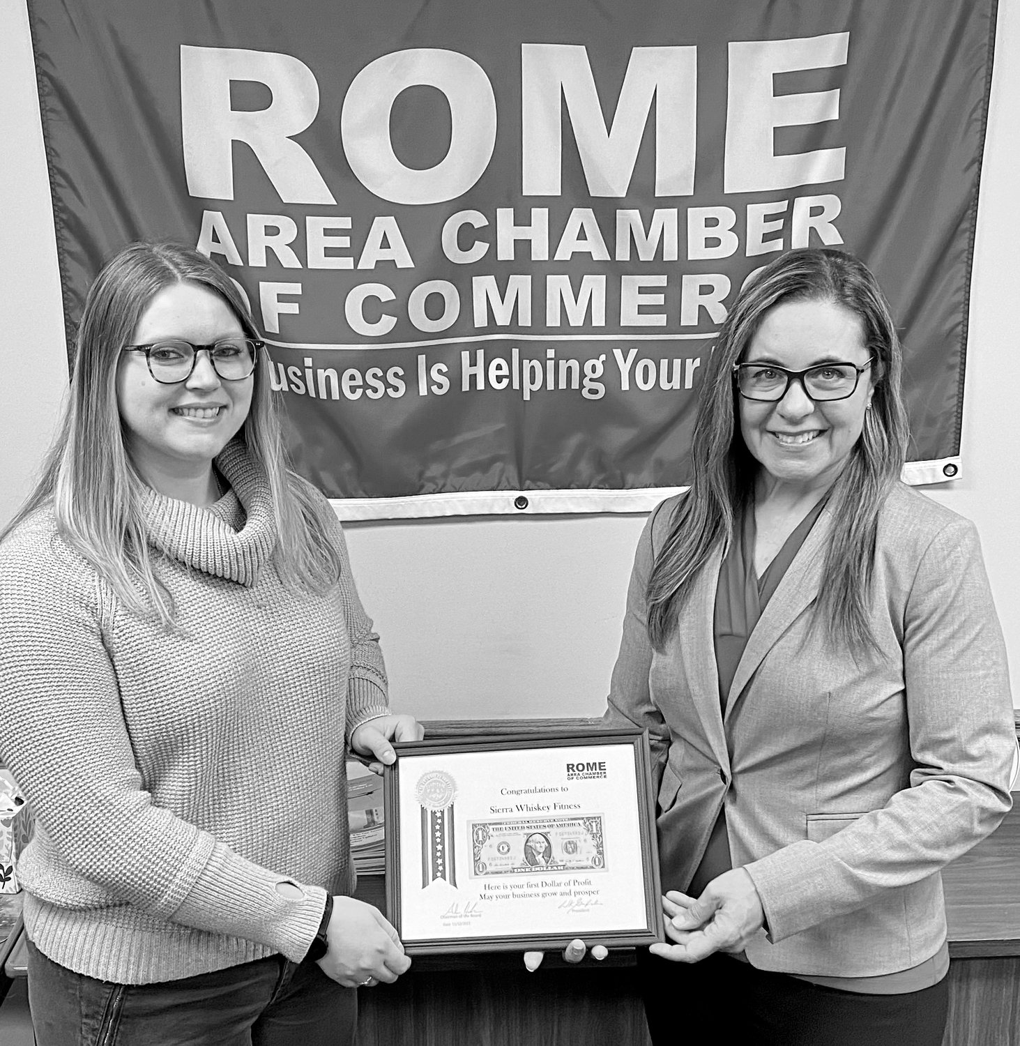 FIRST DOLLAR OF PROFIT - Sierra Rathbun, CPT and owner of Sierra Whiskey Fitness, accepts a First Dollar of Profit award from Lori Frieden, Coldwell Banker Faith Properties and Board member of the Rome Chamber of Commerce.  â€œIt all started in the summer of 2018 after returning from overseas service in the Air Force.  The first thing on my to-do list was to have a dog.  I was able to get my new best friend Whiskey (aka The Fluffy Golden Monster) back soon after.  Since that day, she has been my coach and training partner.  I discovered that having a dog only increased my physical activity and improved my mental health.  Fast forward to 2021, Sierra Whiskey Fitness was born with an emphasis on embracing fitness as a way of life.  Rathbun, a NASM Certified Personal Trainer, seeks to help individuals identify goals and help them design and guide them with a personalized exercise program.  For more information, go online at https://www.sierrawhiskeyfitness.com, Facebook @sierrawhiskeyfitness or call 315-335-3117.  (Photo submitted)