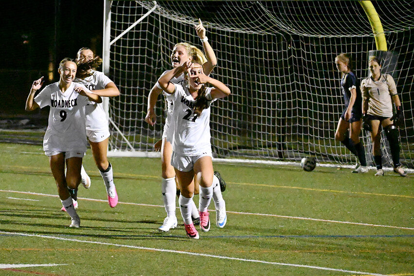 Mia Orso and Avery Katzen (2) celebrated Orso&rsquo;s long-range goal against the Falcons.