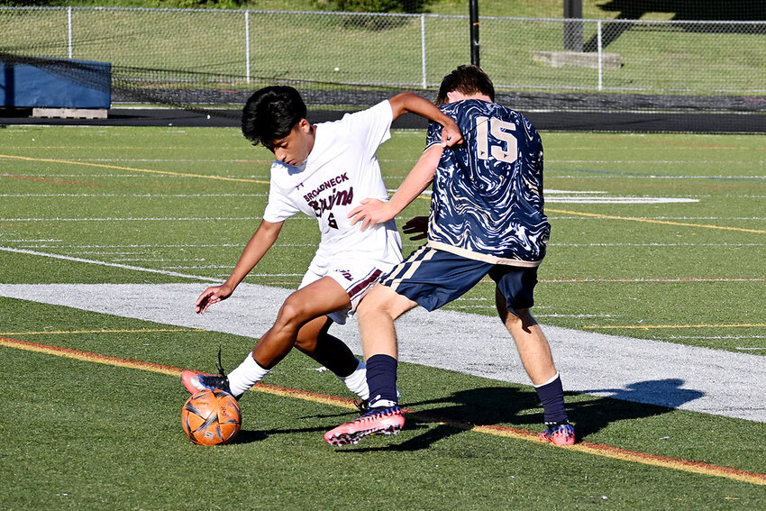 Broadneck midfielder J.J. Herrera turned a defender during their game against the Falcons.