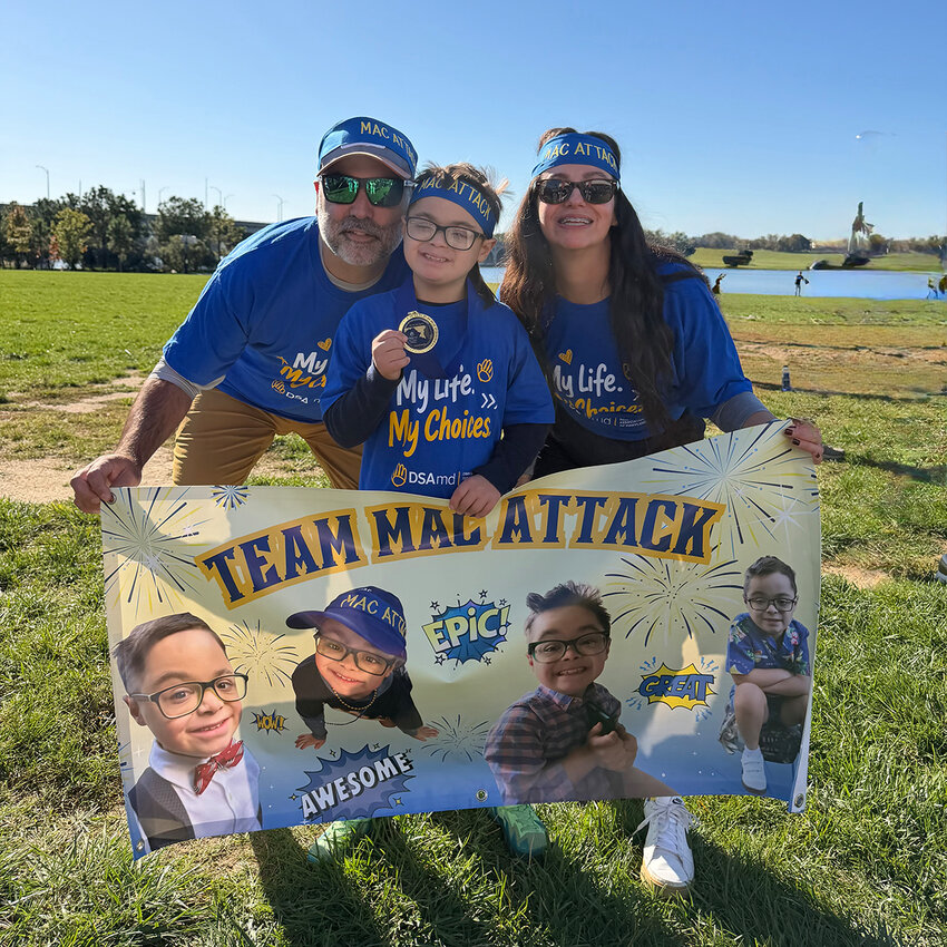 Mac Bartgis, pictured with parents Samantha and Michael Bartgis, led Team Mac Attack, which raised more than $8,000 for the Step Up for Down Syndrome Walk, an annual fundraiser and walk supporting the Down Syndrome Association of Maryland.