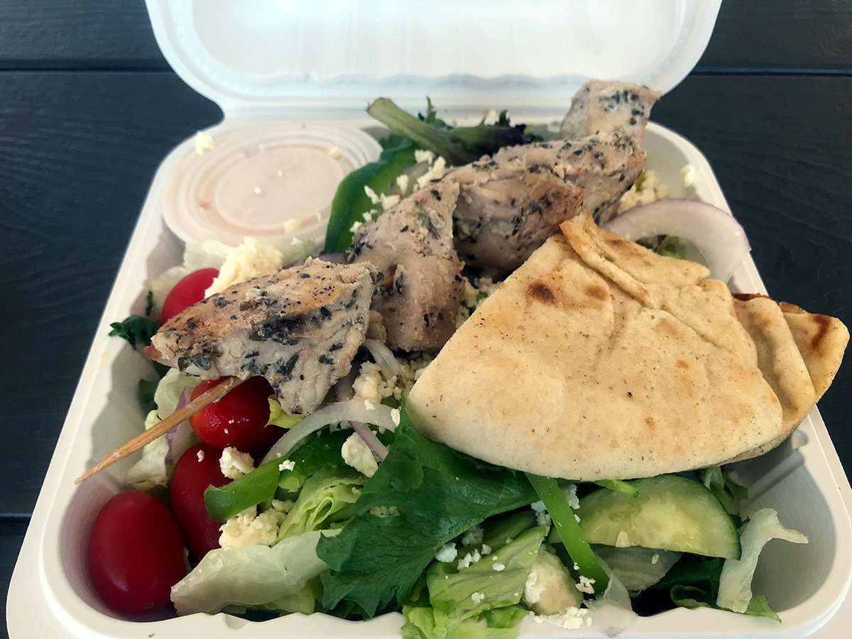 The chicken salad had large, tender chunks of seasoned chicken served atop fresh greens and cucumbers, tomatoes and red onions. It is served with Greek dressing and warm slices of pita.