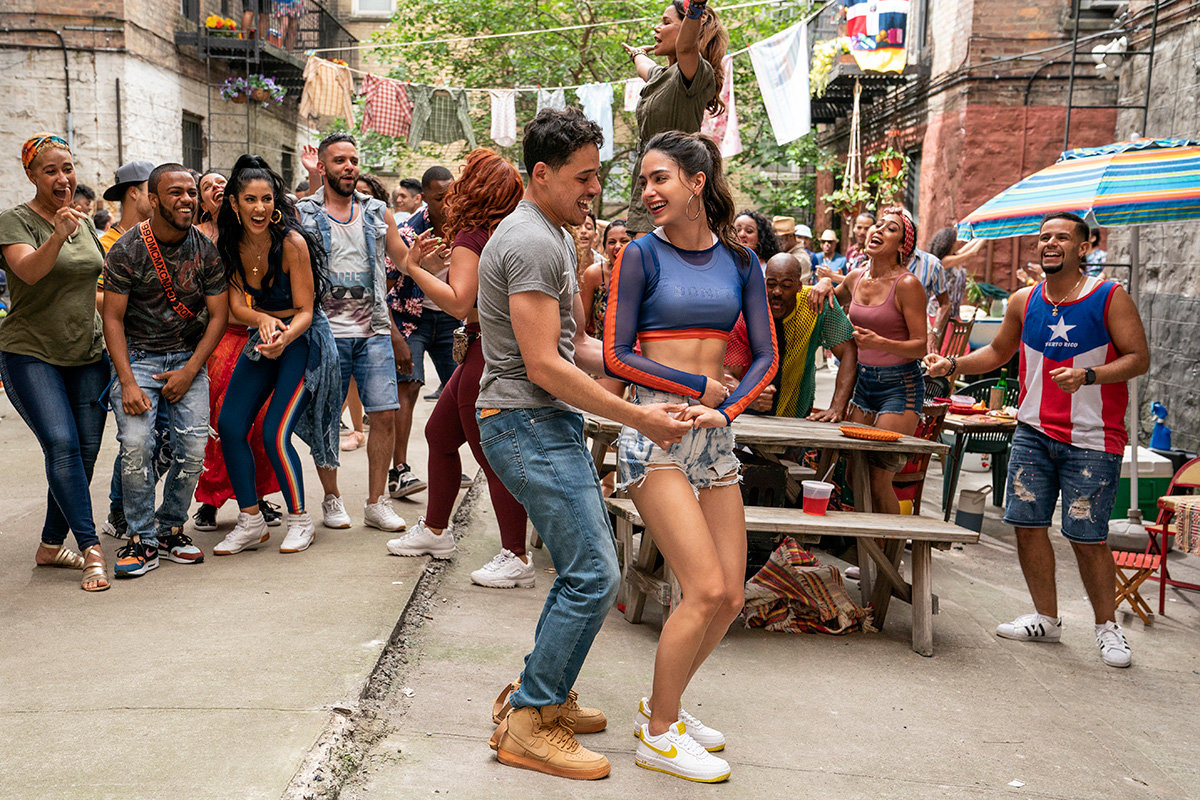 Anthony Ramos portrays Usnavi and Melissa Barrera plays Vanessa in the film “In the Heights.”