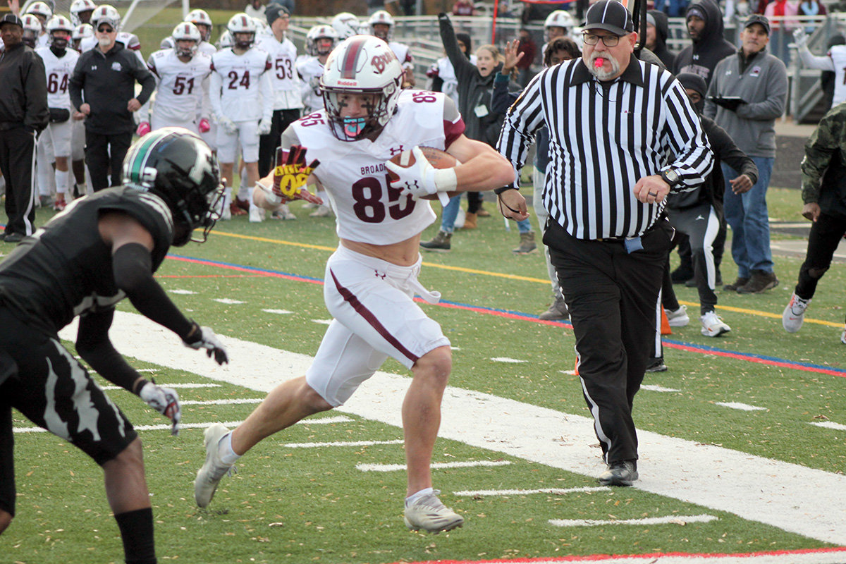 Nathan Leviski prepared to avoid a tackle at the goal line to score a go-ahead touchdown.